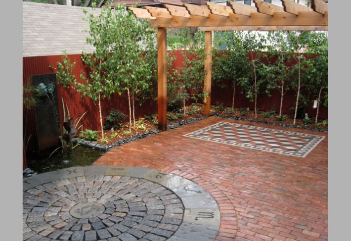 natural flagstone patio with pergola and waterfeature in minneapolis